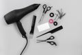 Hairdresser set with various accessories on gray background Royalty Free Stock Photo