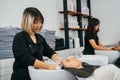 Hairdresser shampooing hair of female customer Royalty Free Stock Photo