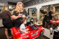 Hairdresser shearing a child