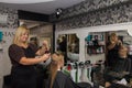 Hairdresser shearing a girl