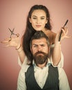 Hairdresser shears the client in the hairdresser. Happy positive woman and bearded man, hairdresser