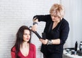 Hairdresser straightening hair