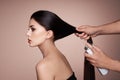 Hairdresser styling womans hair