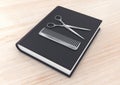 Hairdresser tool on a book