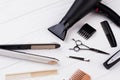 Hairdresser tools and accessories on wooden table. Royalty Free Stock Photo