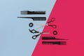 Hairdresser tools on blue and pink background with copy space, top view, flat lay. Royalty Free Stock Photo