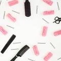 Hairdresser tools - combs, curlers, and hair clips on white background. Beauty composition. Copy space. Flat lay, top view Royalty Free Stock Photo