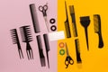 Hairdresser tools on pink and yellow background with copy space, top view, flat lay. Royalty Free Stock Photo