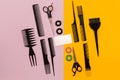 Hairdresser tools on pink and yellow background with copy space, top view, flat lay. Royalty Free Stock Photo