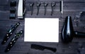 Hairdresser tools on wooden background. Blank card with barber tools flat lay. Top view on wooden table with scissors, comb.