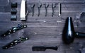 Hairdresser tools on wooden background. Top view on wooden table with scissors, comb, clipper and hairdryerl, free space.