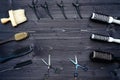 Hairdresser tools on wooden background. Top view on wooden table with scissors, comb, hairbrushes and hairclips, free space.