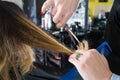 Hairdresser trimming ombre hair with scissors Royalty Free Stock Photo