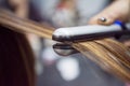 Hairdresser using hair straightener