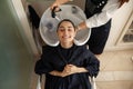 Hairdresser washes woman`s hair, top view Royalty Free Stock Photo