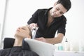 Hairdresser Washing Client's Hair At Parlor