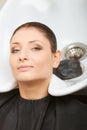 Hairdresser washing her woman customer hair Royalty Free Stock Photo