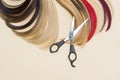 Hairdressing accessories scissors and a lock of hair. Hairdresser service.