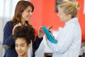 hairdressing apprentice talking to teacher Royalty Free Stock Photo