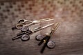 Hairdressing different scissors on table in professional hairdressing salon. Selective focus