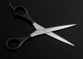 Hairdressing scissors isolated black background Royalty Free Stock Photo