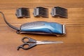 Hairdressing set for hair cutting : trimmer, nozzles, scissors . Royalty Free Stock Photo