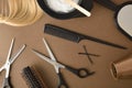 Hairdressing tools for haircut and color on brown table Royalty Free Stock Photo