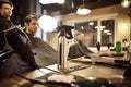 Hairdressing tools. Haircut spray and other tools stand on the table in the barbershop