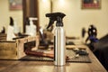 Hairdressing tools. Haircut spray and other tools stand on the table in the barbershop