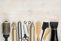 Hairdressing tools on wooden background with copy space at top Royalty Free Stock Photo