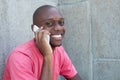 Hairless african american man laughing at phone