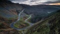 A hairpin bend in a steep mountain road.