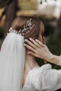 Hairstyle with an elegant wedding hair accessory. Photo from the back. Royalty Free Stock Photo
