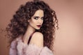 Hairstyle. Fashion brunette girl with Long curly hair, beauty ma Royalty Free Stock Photo