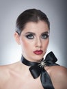 Hairstyle and Make up - beautiful female art portrait with black ribbon. Elegance. Genuine Natural brunette with ribbon - studio