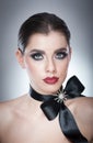 Hairstyle and Make up - beautiful female art portrait with black ribbon. Elegance. Genuine Natural brunette with ribbon - studio