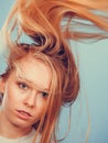 Crazy blonde woman with windblown blonde hair Royalty Free Stock Photo