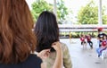 Hairstyling, The back. The long hair of a young woman. purple hair highlights