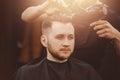 Hairstylist washing client hair in barber shop Royalty Free Stock Photo