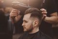 Hairstylist washing client hair in barber shop Royalty Free Stock Photo