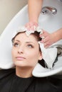 Hairstylist washing woman hair. Hairdressing beauty salon Royalty Free Stock Photo