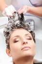 Hairstylist washing woman hair. Hairdressing beauty salon Royalty Free Stock Photo