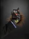 Hairy hand holding cell phone Royalty Free Stock Photo