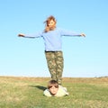 Barefoot girl standing on boy Royalty Free Stock Photo