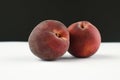 Hairy peaches on a white and black background Royalty Free Stock Photo