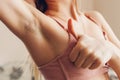 Hairy unshaven female armpits. Body positive trend. Woman wearing bra raised arms. Acceptance of body naturalness Royalty Free Stock Photo