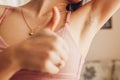 Hairy unshaven female armpits. Body positive trend. Woman wearing bra raised arms. Acceptance of body naturalness Royalty Free Stock Photo