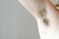 Hairy woman`s armpit, close-up, unshaven, a lot of hair on the armpit Royalty Free Stock Photo