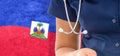 Haiti flag female doctor with stethoscope