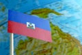 Haiti flag with a globe map as a background